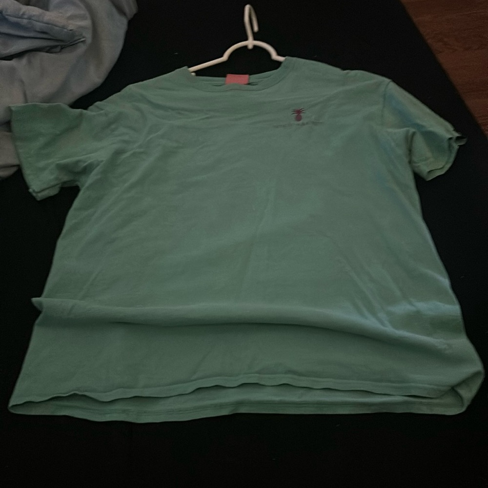 This shirt is an aqua simply southern shirt with purple designs and is a large.